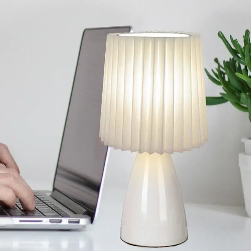 Orange ceramic milkshake bedside lamp with pleated shade for bedroom
