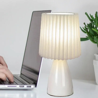 Orange ceramic milkshake bedside lamp with pleated shade for bedroom