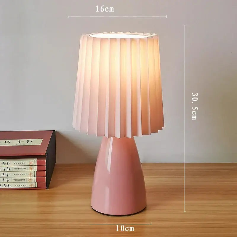 Orange ceramic milkshake bedside lamp with pleated shade for bedroom