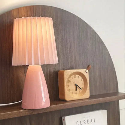 Orange ceramic milkshake bedside lamp with pleated shade for bedroom