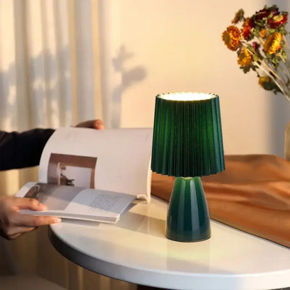 Orange ceramic milkshake bedside lamp with pleated shade for bedroom
