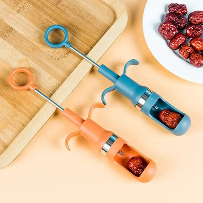 Orange metal cherry pitter fruit core remover kitchen tool