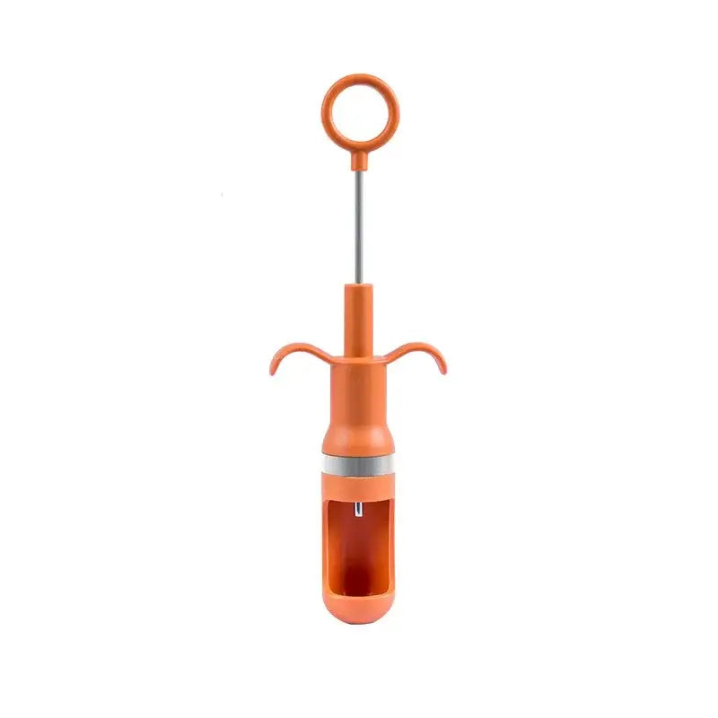 Orange metal cherry pitter fruit core remover kitchen tool