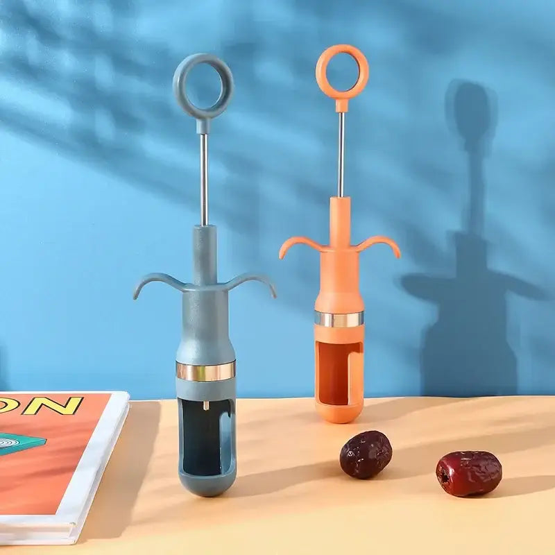 Orange metal cherry pitter fruit core remover kitchen tool