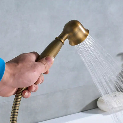 Ornate antique brass freestanding bathtub filler with handshower bathroom