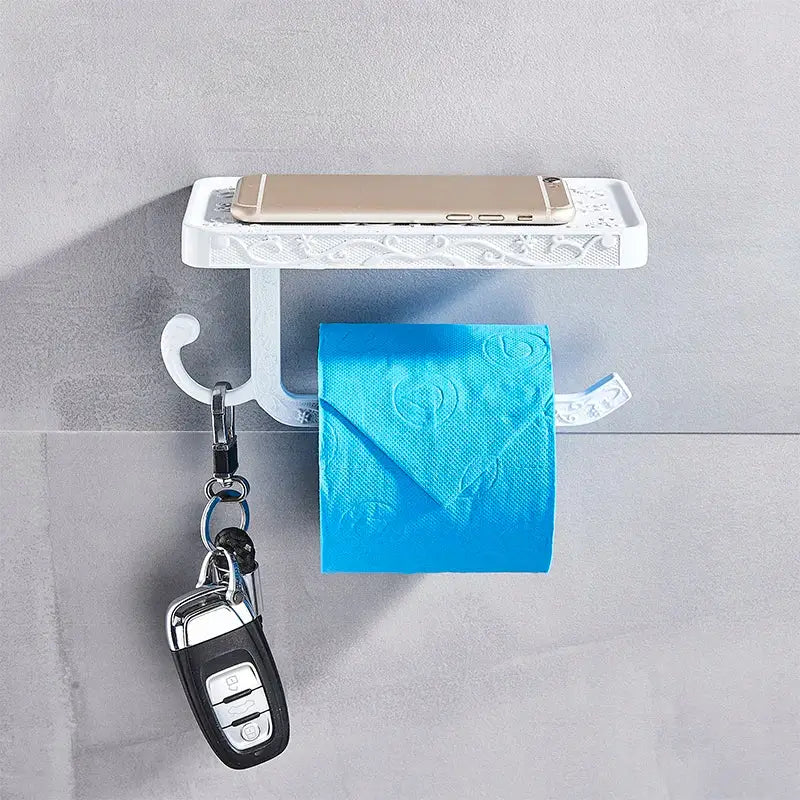 Ornate black metal toilet paper holder with phone shelf bathroom storage