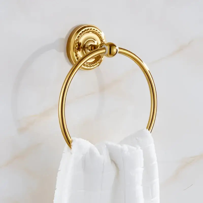 Ornate brass gold bathroom hardware set with towel rack and hooks