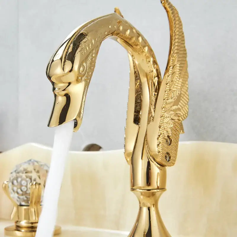 Ornate gold swan basin faucet with crystal handles for bathroom