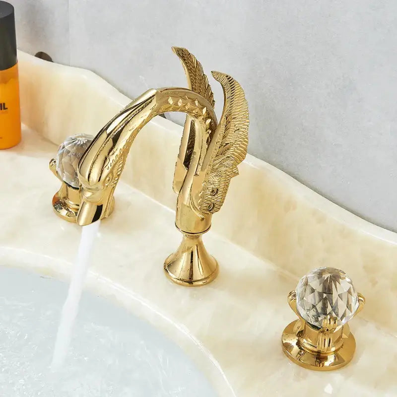 Ornate gold swan basin faucet with crystal handles for bathroom