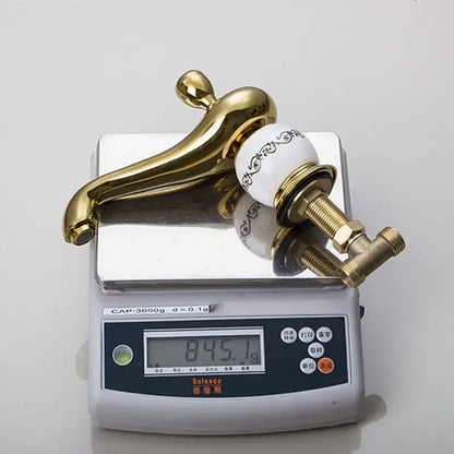 Ornate gold & white porcelain bathroom faucet set