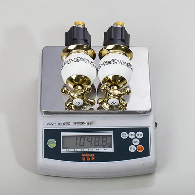 Ornate gold & white porcelain bathroom faucet set