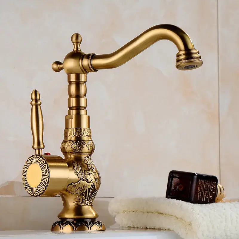 Ornate golden brass carved bathroom faucet hot and cold mixer tap