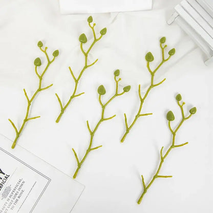 Pink and white artificial flower stems for wedding garden arch decor