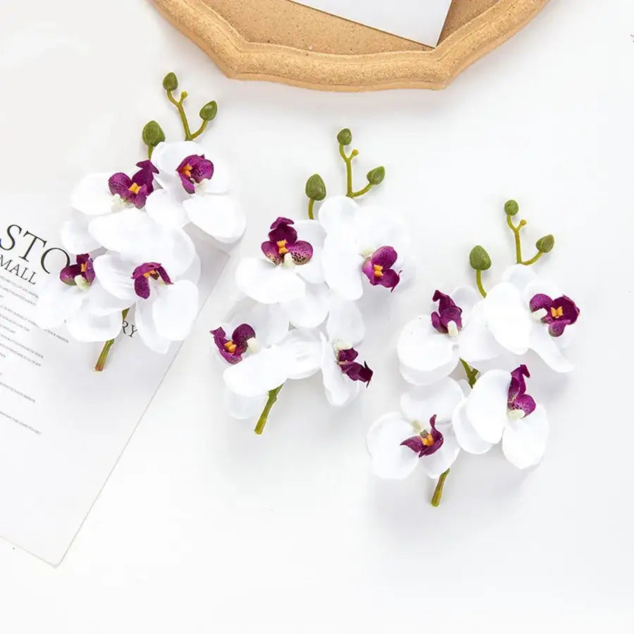 Pink and white artificial flower stems for wedding garden arch decor