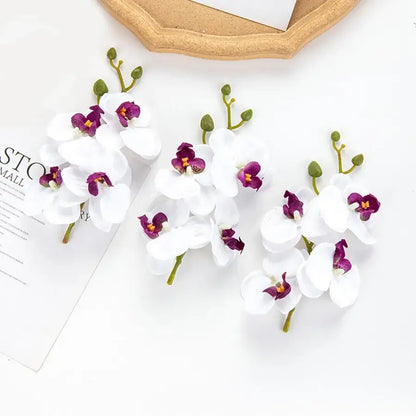 Pink and white artificial flower stems for wedding garden arch decor