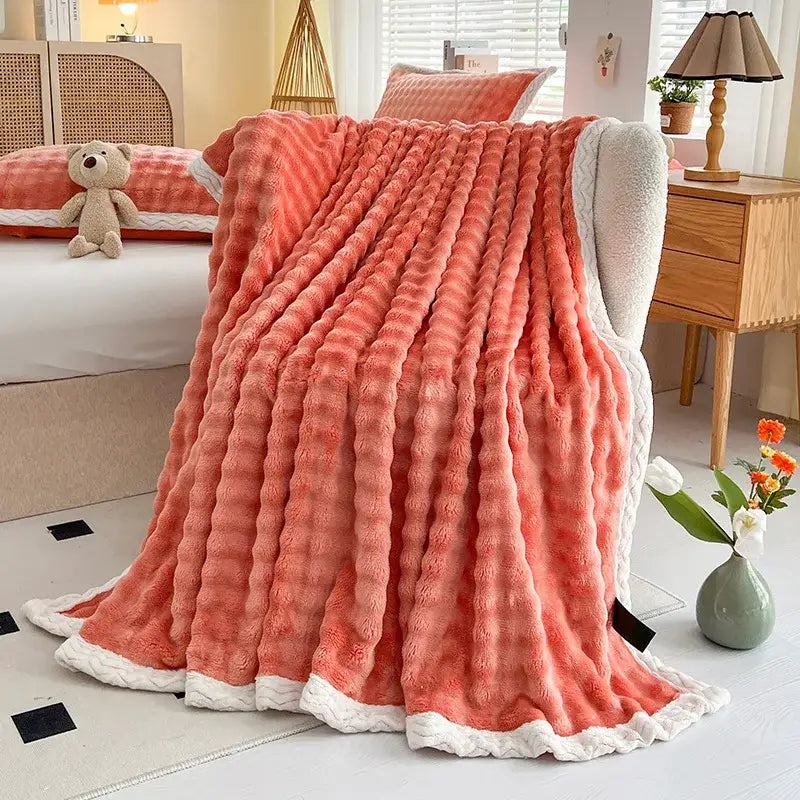 Pink and white textured cozy faux rabbit fur throw blanket bedroom