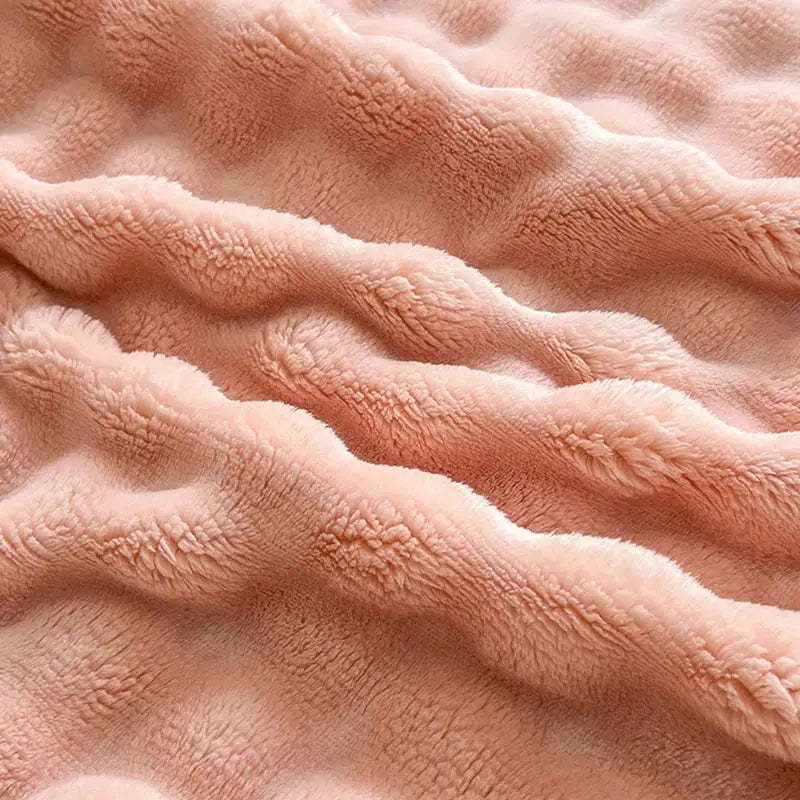 Pink and white textured cozy faux rabbit fur throw blanket bedroom