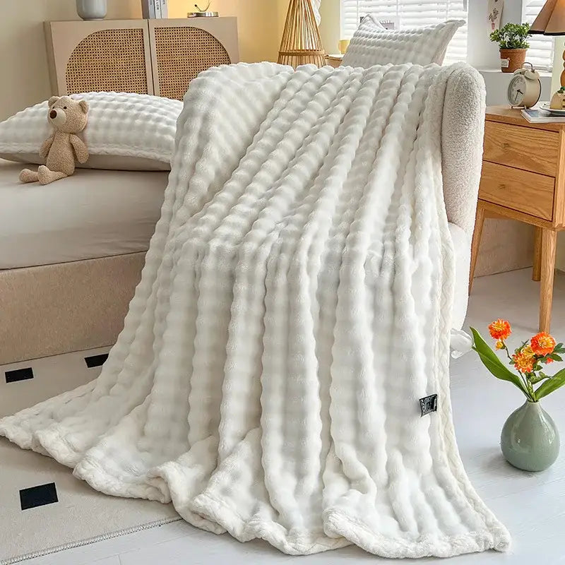 Pink and white textured cozy faux rabbit fur throw blanket bedroom