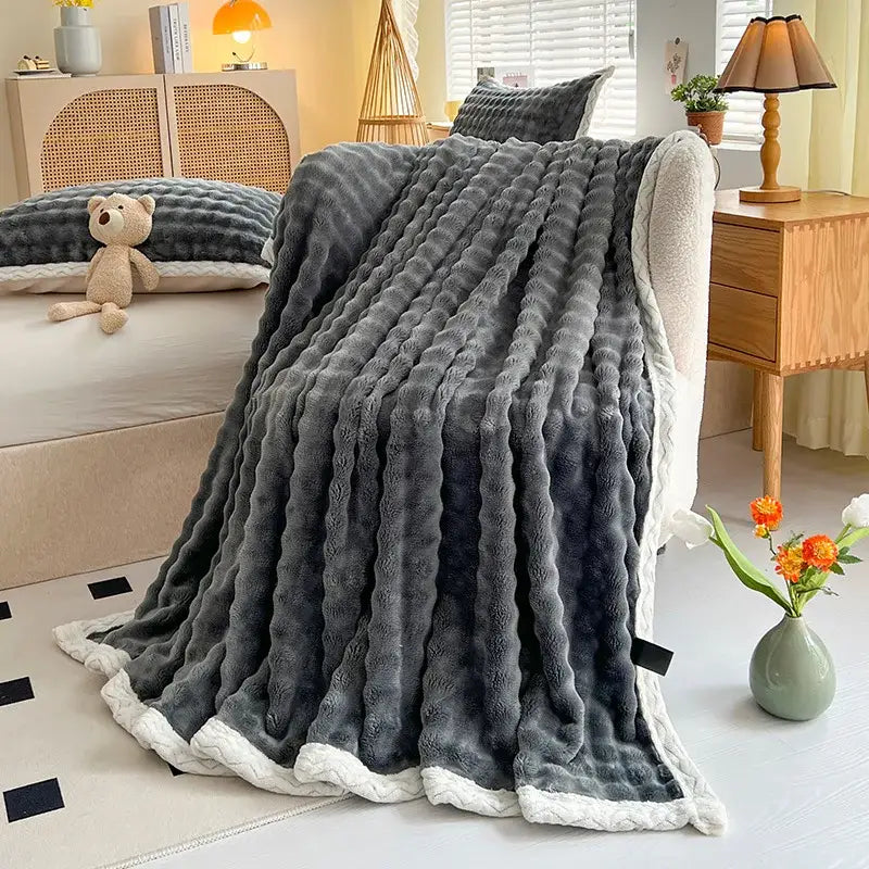 Pink and white textured cozy faux rabbit fur throw blanket bedroom