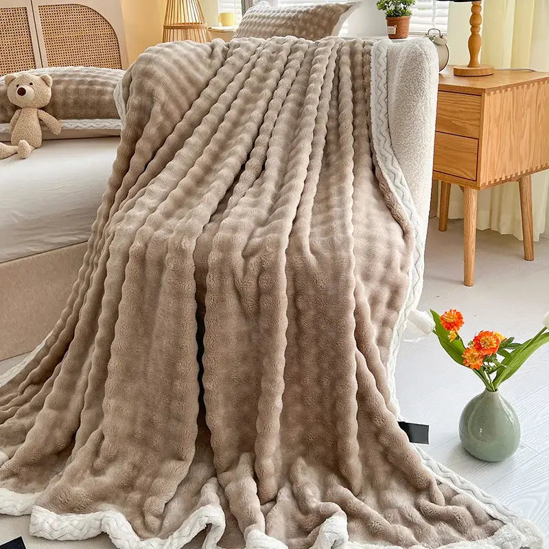Pink and white textured cozy faux rabbit fur throw blanket bedroom