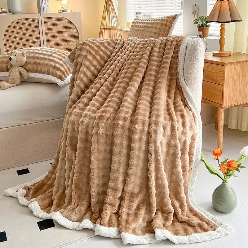 Pink and white textured cozy faux rabbit fur throw blanket bedroom
