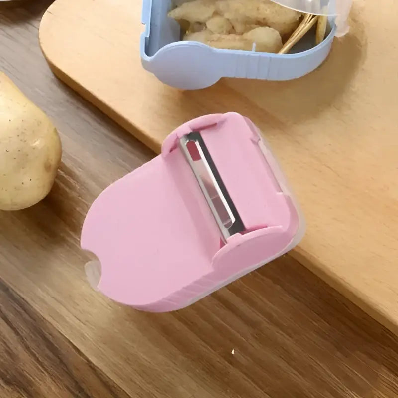 Pink translucent carrot snail peeler kitchen vegetable tool