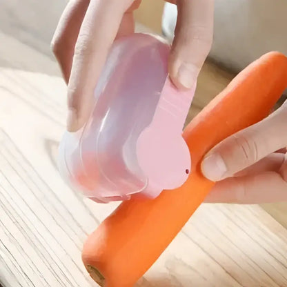 Pink translucent carrot snail peeler kitchen vegetable tool