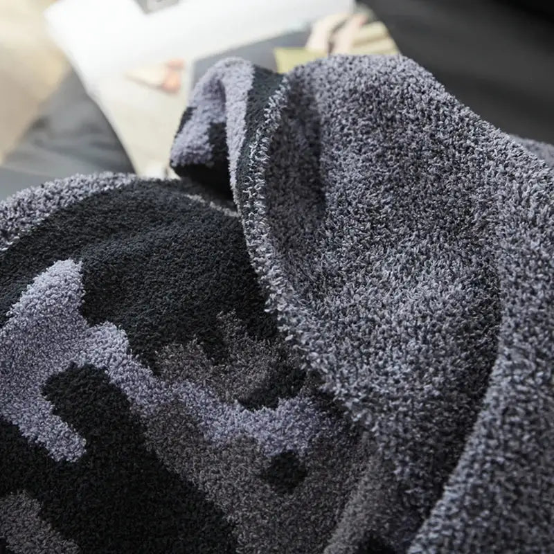 Plush dark gray & black camouflage knitted throw blanket bedroom