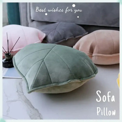 Plush leaf shaped throw pillows in sage and mustard for living room