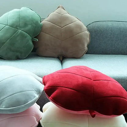 Plush leaf shaped throw pillows in sage and mustard for living room