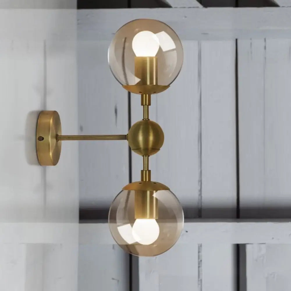 DecorBites™ Post Modern Amber Glass Globe Wall Sconce with Brass Mount - 1/2 Light