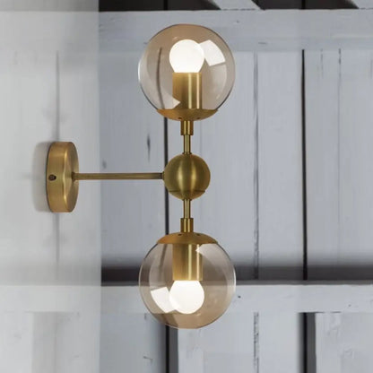 DecorBites™ Post Modern Amber Glass Globe Wall Sconce with Brass Mount - 1/2 Light