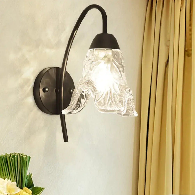 Post-modern black metal wall sconce with clear crystal shade bedroom