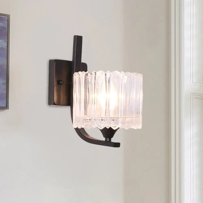 Post-modern black metal wall sconce with clear crystal shade bedroom
