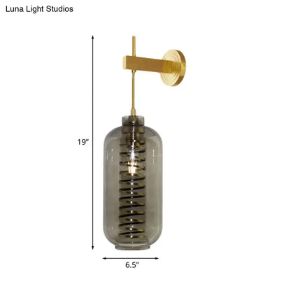 Post-modern brass and smoke gray glass cylinder sconce – bedroom light