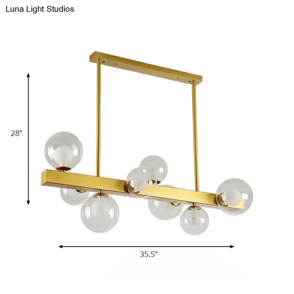 Post modern gold chandelier with glass globes for dining room