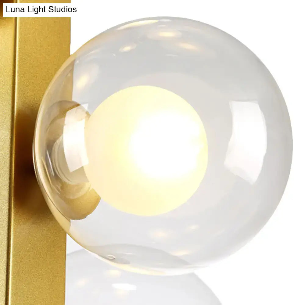 Post modern gold chandelier with glass globes for dining room