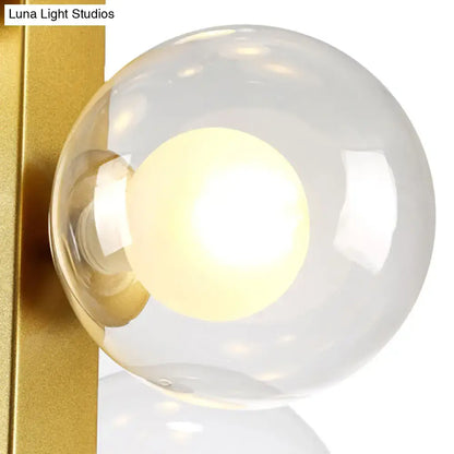 Post modern gold chandelier with glass globes for dining room