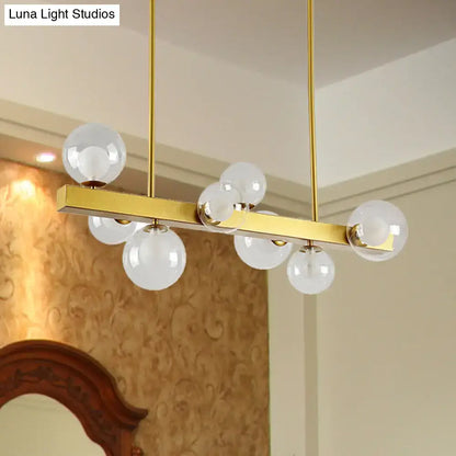 Post modern gold chandelier with glass globes for dining room