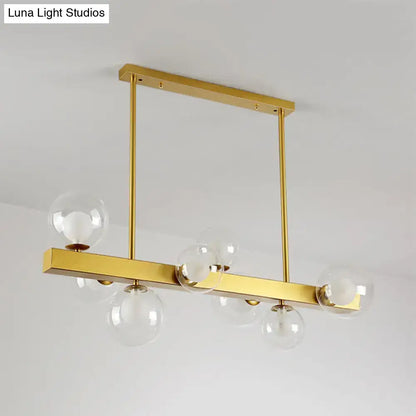 Post modern gold chandelier with glass globes for dining room