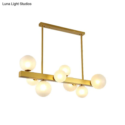 Post modern gold chandelier with glass globes for dining room