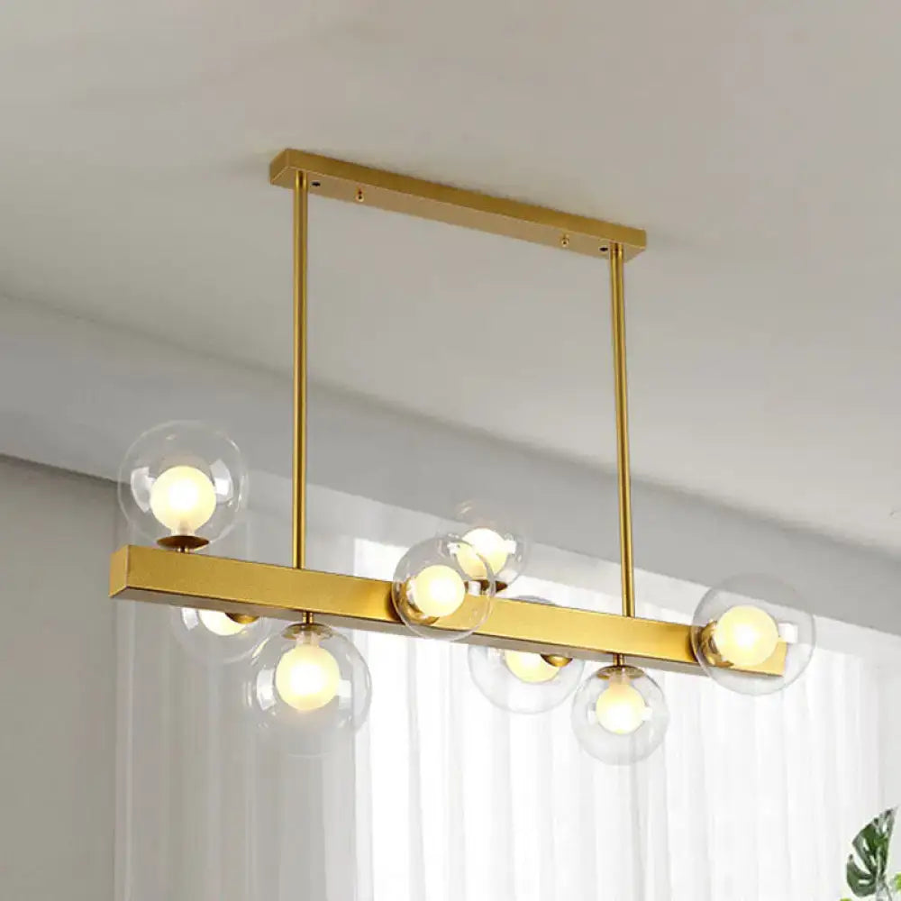 Post modern gold chandelier with glass globes for dining room