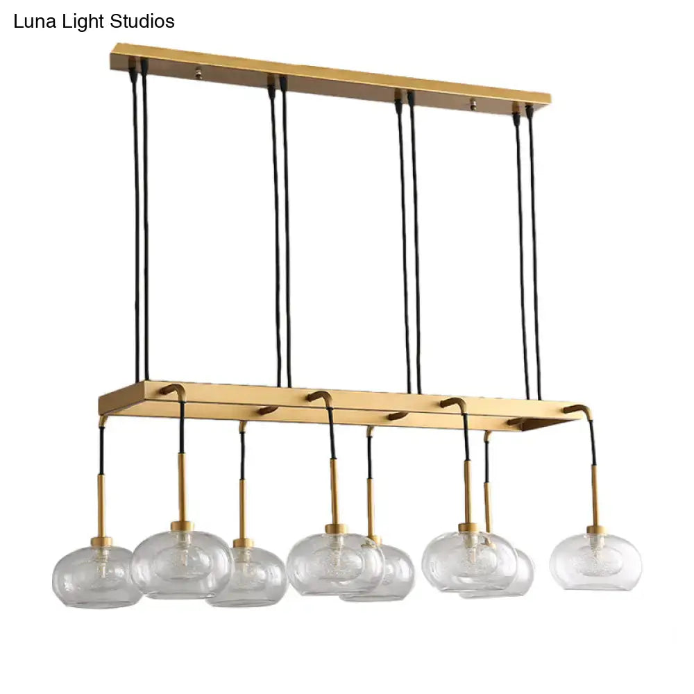 Post-modern gold metal finish island chandelier with clear glass kitchen