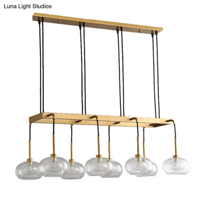 Post-modern gold metal finish island chandelier with clear glass kitchen