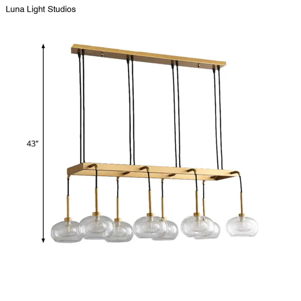 Post-modern gold metal finish island chandelier with clear glass kitchen