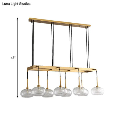 Post-modern gold metal finish island chandelier with clear glass kitchen