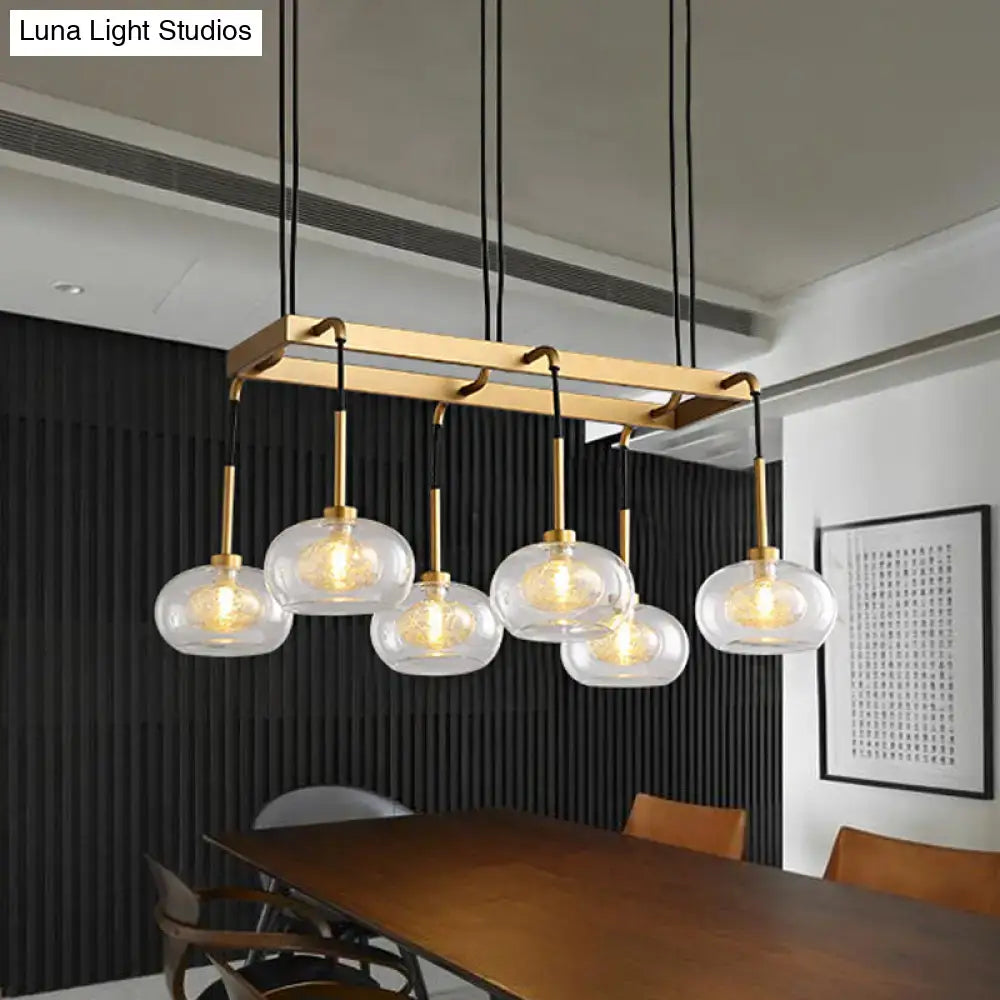 Post-modern gold metal finish island chandelier with clear glass kitchen