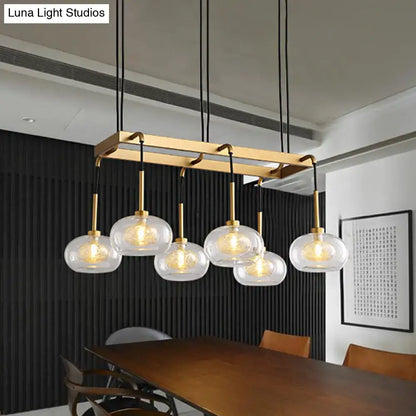 Post-modern gold metal finish island chandelier with clear glass kitchen