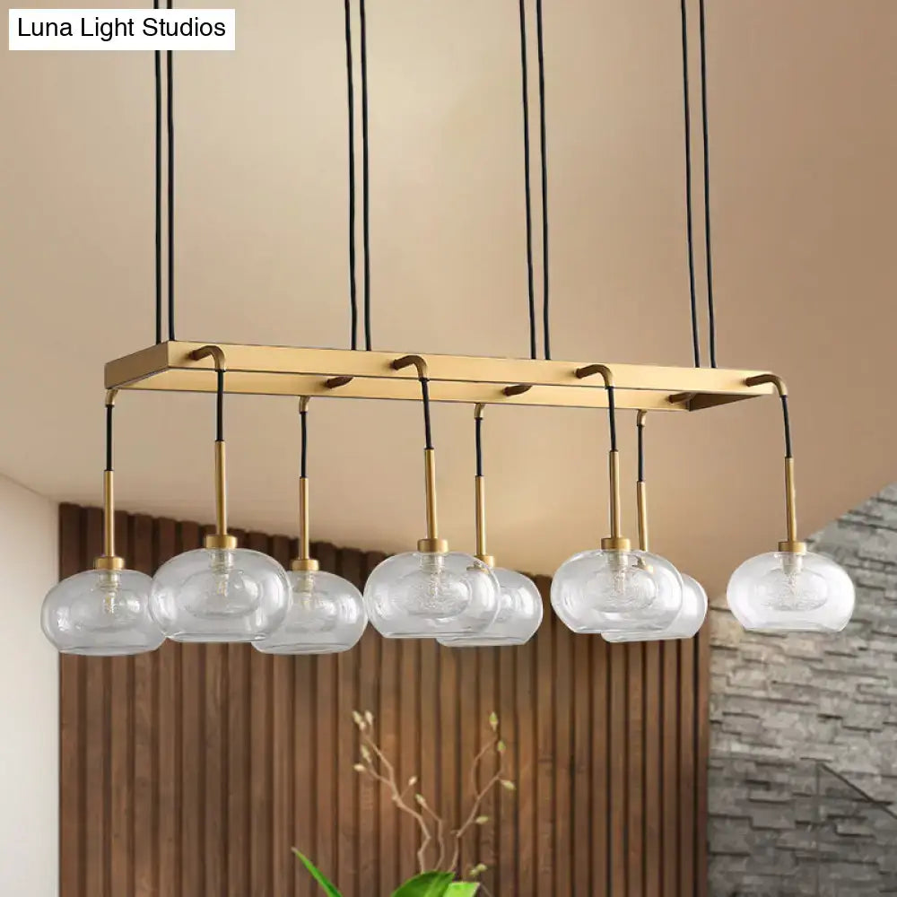 Post-modern gold metal finish island chandelier with clear glass kitchen