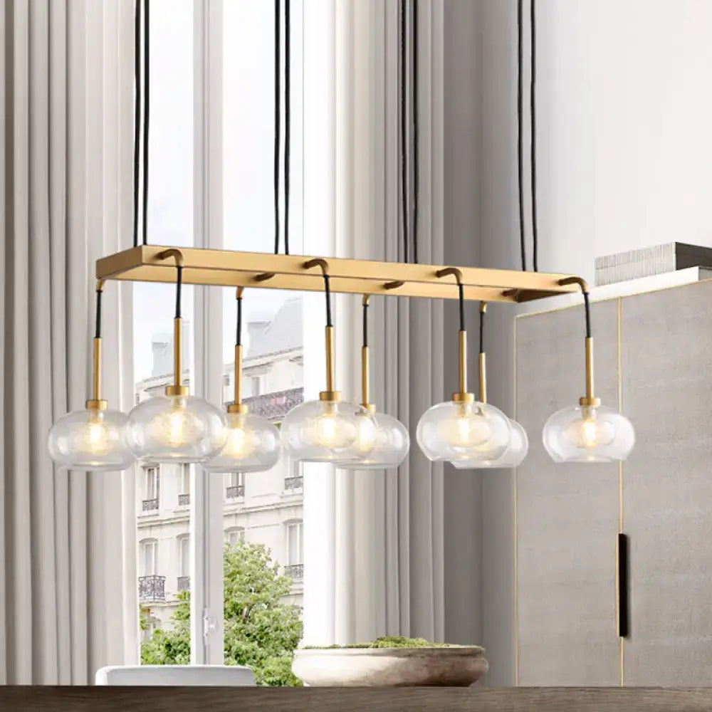 Post-modern gold metal finish island chandelier with clear glass kitchen